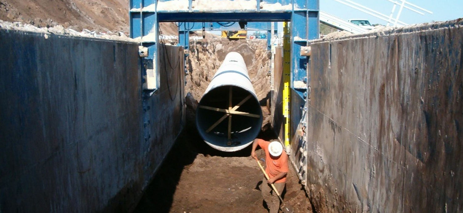 Man working in pipe trench
