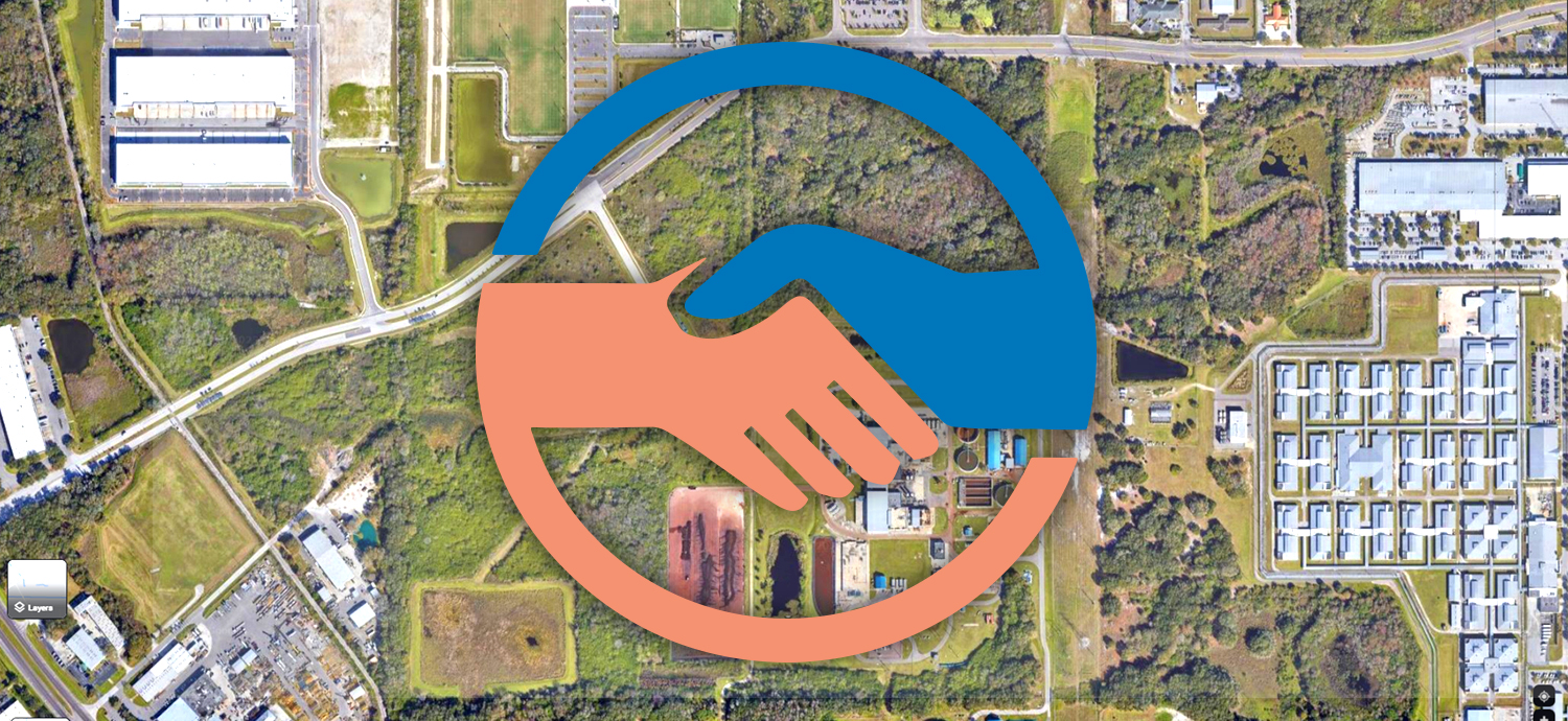 Handshake graphic overlaid on map of proposed land swap area