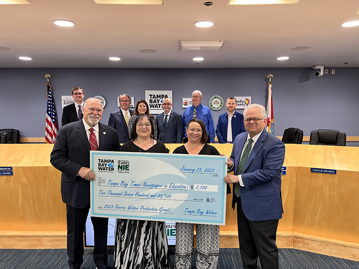 Tampa Bay Times Newspaper in Education receiving Source Water Protection mini-grant check